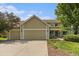 Charming two-story home with a three-car garage, manicured landscaping, and a welcoming entrance at 9346 Lark Sparrow Dr, Highlands Ranch, CO 80126