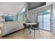 Modern dining area with table and chairs, adjacent to living room at 13824 E Lehigh Ave # B, Aurora, CO 80014