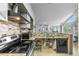Open kitchen with a breakfast bar seamlessly connects to the living area, offering a modern living space at 13824 E Lehigh Ave # B, Aurora, CO 80014