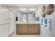 Bathroom featuring a large mirror, double vanity, and walk-in shower at 3285 Belleville Ridge Rd, Elizabeth, CO 80107