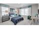 Nicely decorated bedroom with large windows, desk, and dresser at 3285 Belleville Ridge Rd, Elizabeth, CO 80107
