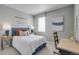 Comfortable bedroom with large window, desk, and stylish decor at 3285 Belleville Ridge Rd, Elizabeth, CO 80107