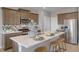 Modern kitchen featuring stainless steel appliances and a large island with seating at 3285 Belleville Ridge Rd, Elizabeth, CO 80107
