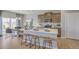 Bright kitchen features an island with bar seating and modern appliances, next to a breakfast nook at 3285 Belleville Ridge Rd, Elizabeth, CO 80107