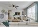 Comfortable living room featuring decorative windmill art and a large flat screen tv at 3285 Belleville Ridge Rd, Elizabeth, CO 80107