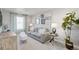 Cozy living room with soft gray sofa, decorative pillows, and artwork at 3285 Belleville Ridge Rd, Elizabeth, CO 80107