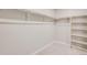Walk-in closet with carpet, shelving and bright, neutral paint at 3285 Belleville Ridge Rd, Elizabeth, CO 80107
