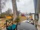 Back patio with comfortable chairs, a table, and a view of the expansive backyard at 8950 W 26Th, Lakewood, CO 80215