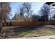 Expansive backyard with a wooden fence, offering plenty of space for outdoor activities at 8950 W 26Th, Lakewood, CO 80215