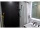Contemporary bathroom featuring black hexagonal tiles, modern fixtures and stylish shower design at 8950 W 26Th, Lakewood, CO 80215