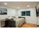 Cozy bedroom with hardwood floors, a comfortable daybed, and bright natural light at 8950 W 26Th, Lakewood, CO 80215
