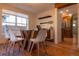 Bright dining room with stylish decor, a modern table and view of the kitchen at 8950 W 26Th, Lakewood, CO 80215