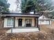 Charming home with a welcoming front porch and mature trees in the yard at 8950 W 26Th, Lakewood, CO 80215