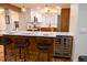 Spacious kitchen with bar seating, built in wine cooler and eat-in kitchen nearby at 8950 W 26Th, Lakewood, CO 80215