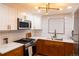Modern kitchen with stainless steel appliances, stylish fixtures, and sleek counter tops at 8950 W 26Th, Lakewood, CO 80215