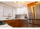 Modern kitchen with stainless steel appliances, subway tile backsplash and sleek counter tops at 8950 W 26Th, Lakewood, CO 80215