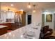 Well-lit kitchen with stainless steel appliances and a spacious marble counter with seating at 8950 W 26Th, Lakewood, CO 80215