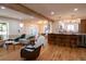 Open-concept floor plan featuring a living room and a bright kitchen with an island at 8950 W 26Th, Lakewood, CO 80215