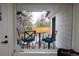 Charming outdoor space with a cozy table and chairs, perfect for relaxing or entertaining guests at 8950 W 26Th, Lakewood, CO 80215
