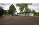 Well maintained home with a long driveway, two car garage, neutral paint, and mature trees at 8950 W 26Th, Lakewood, CO 80215