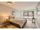 Bright bedroom with floor-to-ceiling sliding glass doors provides an open and airy feel with plenty of natural light at 1050 N Corona St # 308, Denver, CO 80218