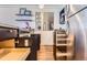A modern kitchen features stainless steel appliances, dark cabinetry, and hardwood floors at 1050 N Corona St # 308, Denver, CO 80218