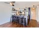 Modern kitchen with peninsula, granite countertops, and stainless steel appliances seamlessly integrates with the open-concept living space at 1050 N Corona St # 308, Denver, CO 80218