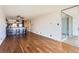 Open living space flows seamlessly from the kitchen, featuring hardwood floors, plenty of light, and a view of the balcony at 1050 N Corona St # 308, Denver, CO 80218