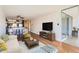 Cozy living room with an open layout to the kitchen and balcony, providing a comfortable and inviting space at 1050 N Corona St # 308, Denver, CO 80218