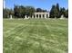 Scenic park view with manicured lawn, fountains, and a colonnade at 1050 N Corona St # 308, Denver, CO 80218