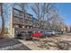 Parking lot view showcasing residents' vehicles at 1050 N Corona St # 308, Denver, CO 80218