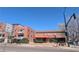 Street view featuring local coffee house with outdoor seating in a commercial area at 1050 N Corona St # 308, Denver, CO 80218