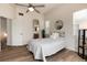 Bright bedroom featuring a comfortable bed, modern lighting, and a view of the ensuite bathroom, creating a relaxing space at 341 Granby Way # A, Aurora, CO 80011