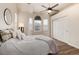 Bedroom with a ceiling fan, large windows, hardwood floors, and a closet at 341 Granby Way # A, Aurora, CO 80011