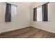 Bedroom with hardwood floors, curtains, and blinds at 341 Granby Way # A, Aurora, CO 80011