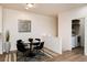 Charming dining area with adjacent laundry room; features a round table and artistic wall decoration at 341 Granby Way # A, Aurora, CO 80011