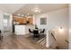 Bright dining area with a round table set for four, adjacent to an open kitchen, perfect for entertaining at 341 Granby Way # A, Aurora, CO 80011