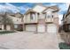 Brick townhomes with light beige siding and two-car garages at 341 Granby Way # A, Aurora, CO 80011