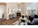 Bright living room with a fireplace, large windows, and stylish accent furnishings at 341 Granby Way # A, Aurora, CO 80011
