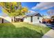 Spacious backyard offers a shed, mature tree, and room to relax at 3315 N Stuart St, Denver, CO 80212