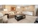 Finished basement living room with neutral tones, built in cabinets, and plush carpeting at 3315 N Stuart St, Denver, CO 80212