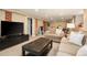 Finished basement living room with brick accents, plush carpeting, and entertainment center at 3315 N Stuart St, Denver, CO 80212