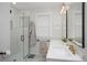 Modern bathroom featuring a glass-enclosed shower, dual vanity, and stylish fixtures at 3315 N Stuart St, Denver, CO 80212