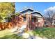 Charming brick home with a welcoming front porch and well-maintained landscaping at 3315 N Stuart St, Denver, CO 80212