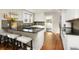 Modern kitchen with granite countertops, stainless steel appliances, and breakfast bar at 3315 N Stuart St, Denver, CO 80212