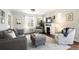 Cozy living room features a fireplace, neutral color scheme, and comfortable seating at 3315 N Stuart St, Denver, CO 80212