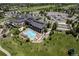 Aerial view of community center with swimming pool, bocce ball and expansive parking at Heritage Eagle Bend at 7633 S Addison Way, Aurora, CO 80016