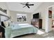Spacious bedroom featuring vaulted ceilings, a ceiling fan, a large window, and carpeted flooring at 7633 S Addison Way, Aurora, CO 80016