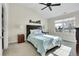 Tranquil bedroom with a high ceiling, featuring a comfortable bed and a window offering natural light at 7633 S Addison Way, Aurora, CO 80016