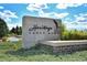 Stone community sign that reads Heritage Eagle Bend with a manicured entrance surrounded by mature landscaping at 7633 S Addison Way, Aurora, CO 80016